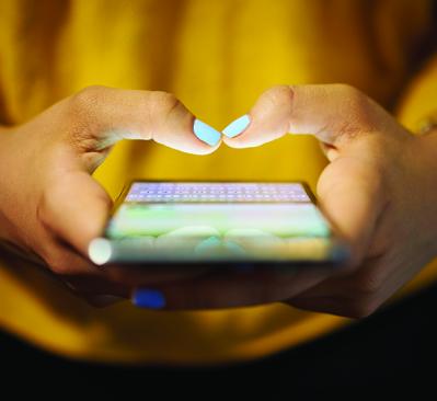 hands holding a cell phone